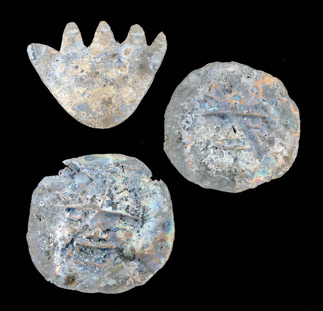 3 Moche Copper Ornaments - Warriors, Hand / Paw: **Originally Listed At $400** Pre-Columbian, North Coast Peru, Moche, ca. 400 to 800 CE. An ensemble of 3 copper repousse attachments: 2 discs displaying the faces of warriors and a stylized hand or p