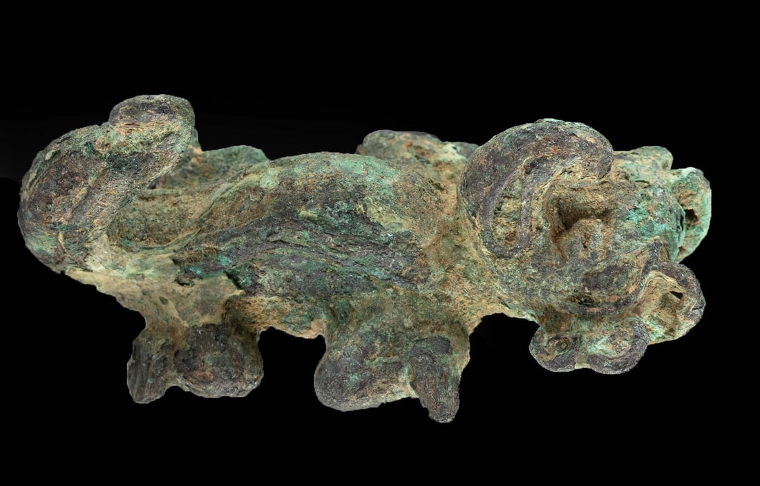 Pre-Columbian Veraguas / Chiriqui Pendant Crocodile: **Originally Listed At $300** Pre-Columbian, Costa Rica / Panama, Veraguas-Chiriqui, ca. 11th to 16th century CE. A cast copper pendant of a stylized crocodilian form - with a hollow open back with a