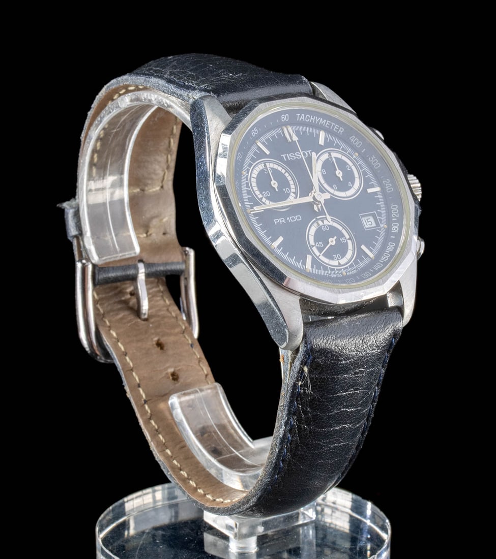 Tissot PR 100 P372 Wristwatch Blue Dial & Leather Strap: Western Europe, Switzerland, ca. late 20th to 21st century CE. A stylish Tissot PR 100 P372/472 wristwatch featuring a stainless steel case and a sleek blue dial, complete with three subdials and a ca