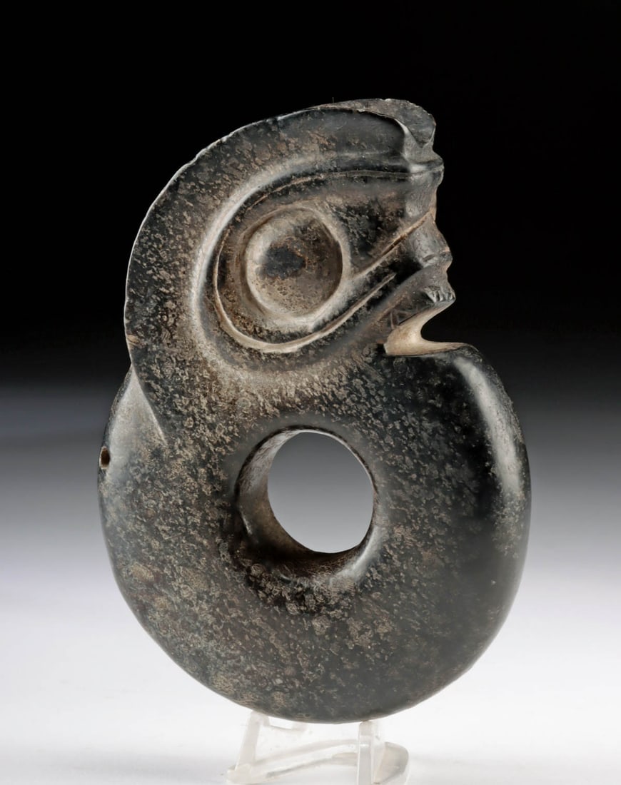 Impressive Chinese Black Jade Amulet Pig Dragon: East Asia, China, Hongshan to Longshan culture, Neolithic Period, ca. 3500 to 1900 BCE. A hand-carved black nephrite jade amulet in the form of an abstract zoomorphic figure, often referred to as a "p