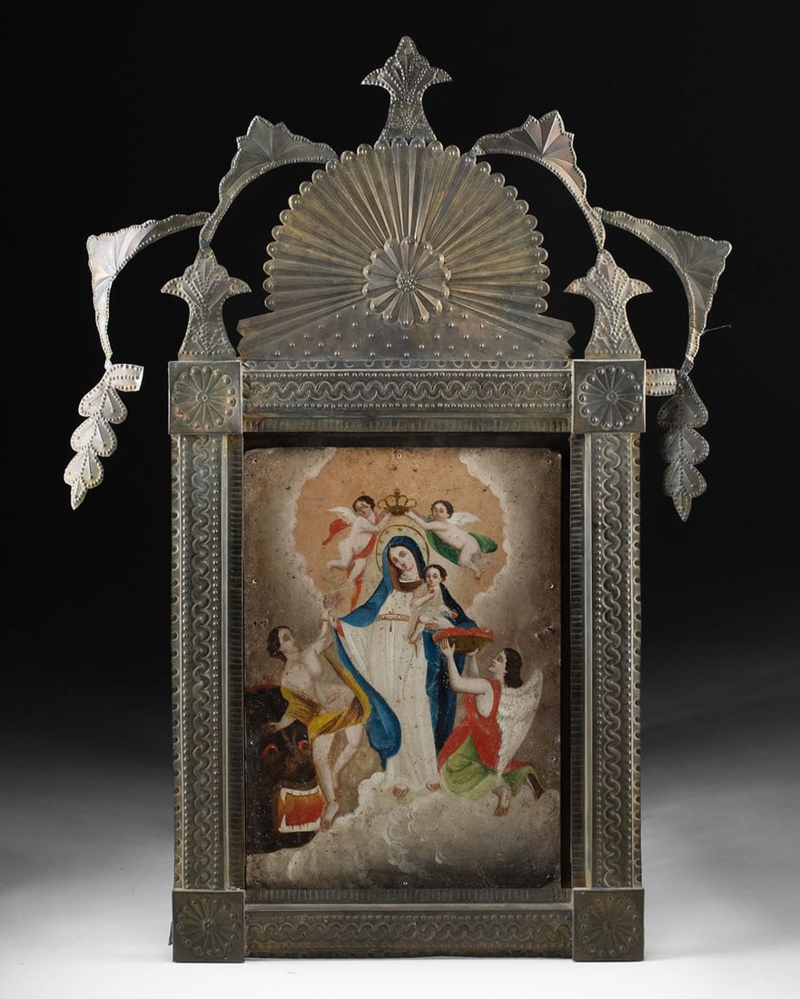 Large 19th C. Mexican Retablo & Nicho, Virgen de la Luz: Latin America, Mexico, ca. 19th century CE. A fine antique Mexican retablo painted on heavy gauge tin depicting the Holy Mother as La Virgen de la Luz (the Virgin of Light) in a carefully worked tin n