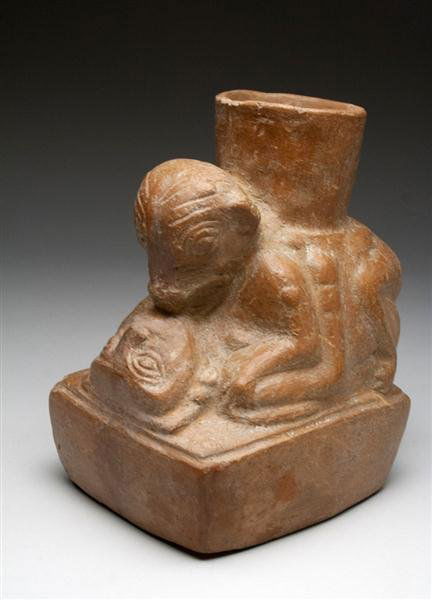 A Moche / Huari Transitional Erotic Vessel: Pre-Columbian, from Northern Peru, Moche V / Huari, Ca 500 to 700 CE. Redware pottery jar in the form of woman engaged sexually with a jaguar god upon a rectangular plynth, spout emerging from the jag