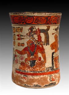 Superb Pre-Columbian Mayan Cylinder, ex-Christie's: Mayan Territories, Guatemala, ca 550 to 800 CE. A spectacular and important Mayan polychrome pottery cylinder! A Maya lord sits wearing a printed loin cloth and elaborate feather and jaguar pelt