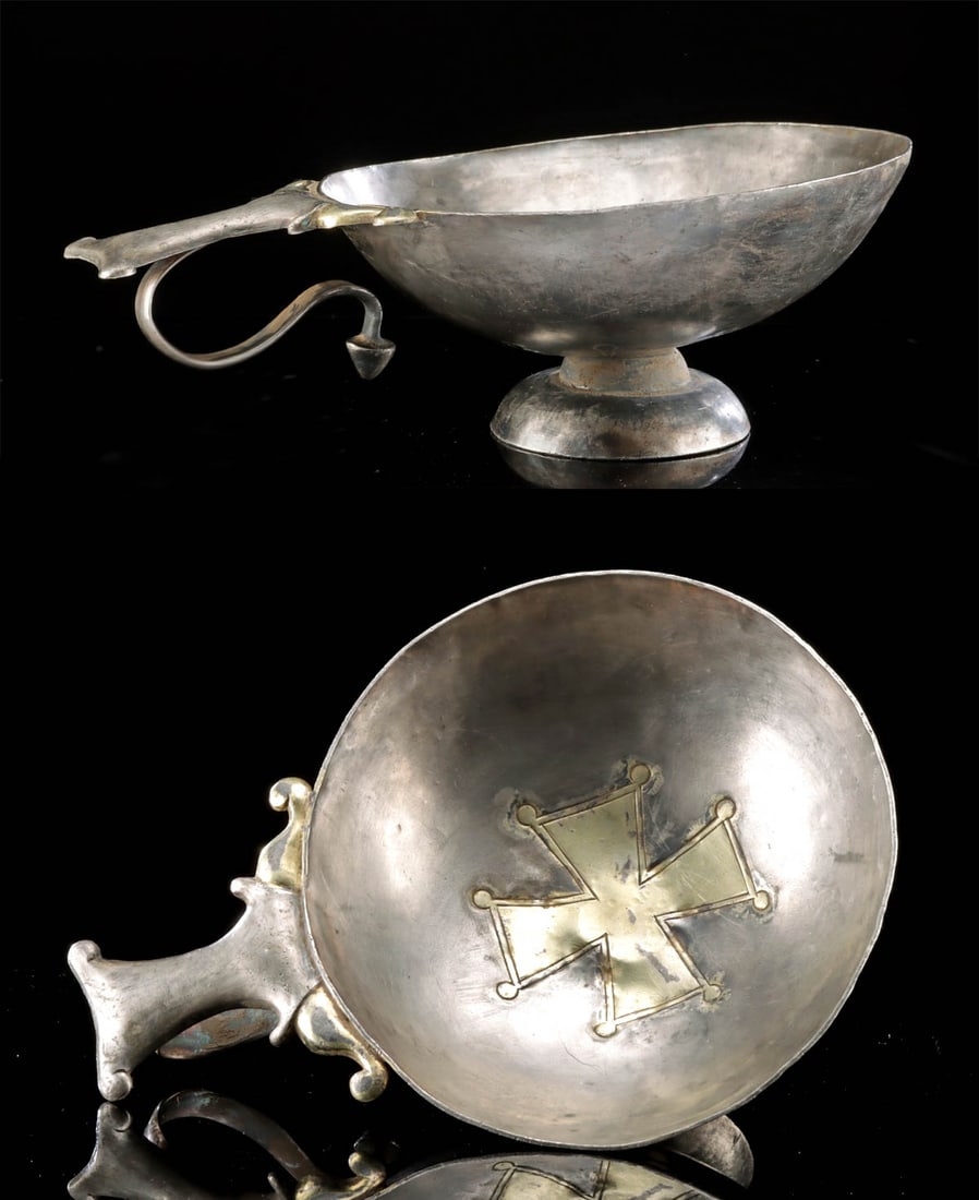 5th C. Byzantine Silver Footed Cup, Gilded Cross: Ancient Near East, Byzantine, ca. 5th to 7th century CE. A beautiful cup created from high-quality silver and adorned with a gilt cross at the center. Sitting upon a tiered, annular foot, the hemisphe