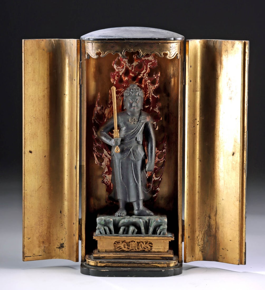 19th C. Japanese Edo Gilt Wood Zushi Shrine of Fudo: East Asia, Japan, Edo to Meiji era, ca. 19th century CE. This stunning lacquered and gilt wood zushi shrine houses a wood statue of Fudo Myoo, a wrathful protector of Buddhist law. Every area with gil