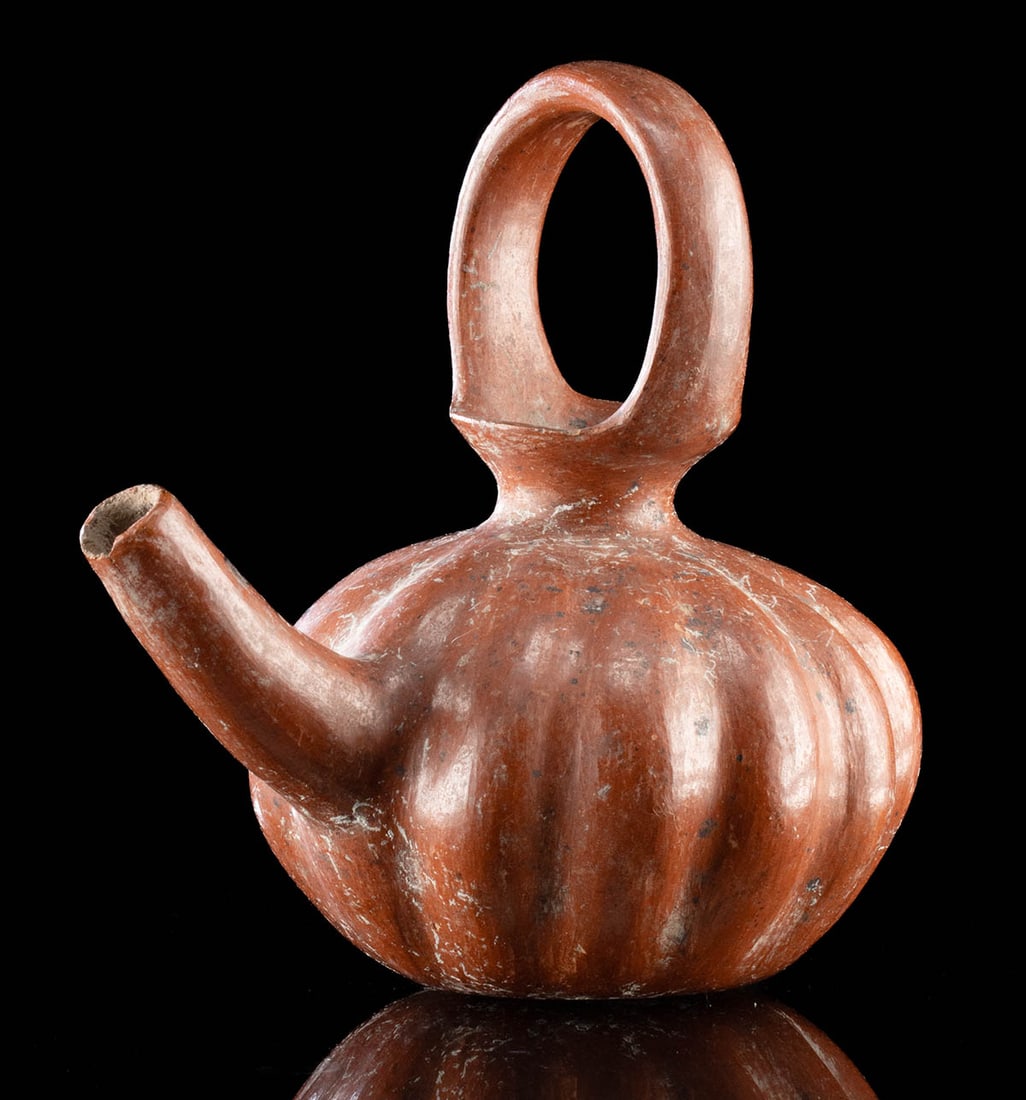 Tarascan Tzin Tzan Tzun Pottery Teapot Vessel: Pre-Columbian, West Mexico, Michoacan area, Tarascan culture, ca. 1350 to 1521 CE. A hand-built redware pottery vessel known as a Tzin Tzan Tzun with a slightly concave base, a compressed circular bod