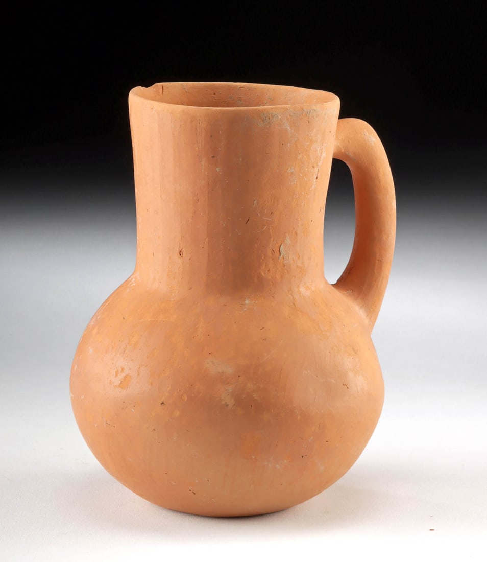 Ancient Amlash Redware Pottery Pitcher: **Originally Listed At $300** Ancient Central Asia, southern Azerbaijan and northern Iran, Ardabil region, Amlash, ca. 1200 to 800 BCE. A petite pottery redware pitcher with a globular body and handle