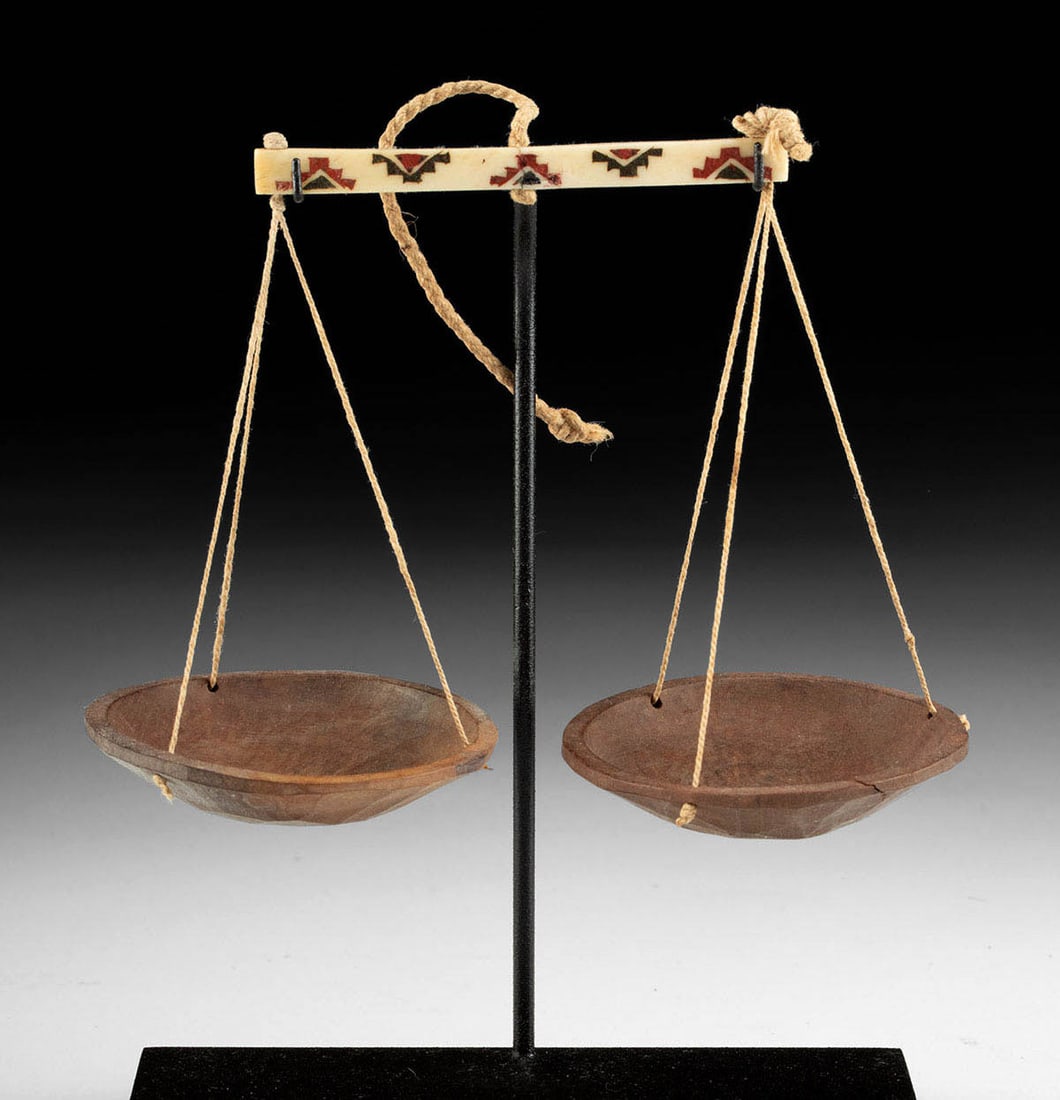 Chimu Balance Scale Bone Beam and Wooden Pans: **Originally Listed At $750** Pre-Columbian, Peru, Chimu, ca. 1100 to 1470 CE. A balance scale for measuring, the wood pans suspended from a bone balance beam via cotton cords. The bone may be from an