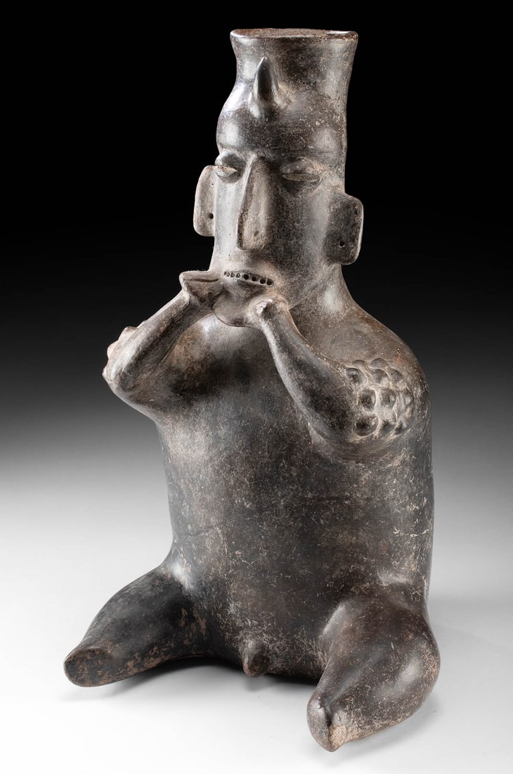 Jalisco Pottery Seated Nude Male Shaman Figure: **Originally Listed At $1000** Pre-Columbian, West Mexico, Jalisco, Protoclassic Period, ca. 100 BCE to 250 CE. A hollow-built pottery male shaman figure seated nude with outstretched legs drawing att