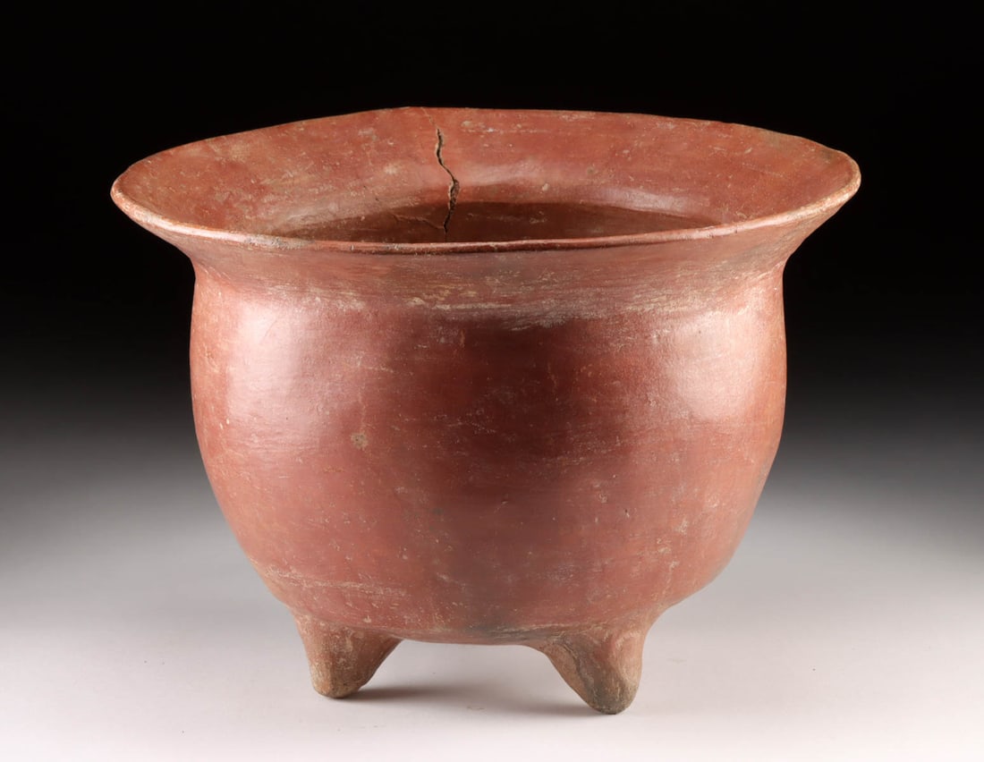 Huge Colima Redware Tripod Bowl: **Originally Listed At $700** Pre-Columbian, West Mexico, Colima, ca. 300 BCE to 300 CE. A splendid and quite sizable pottery tripod vessel boasting a deep basin, wide flaring rim, and 3 petite nubbin
