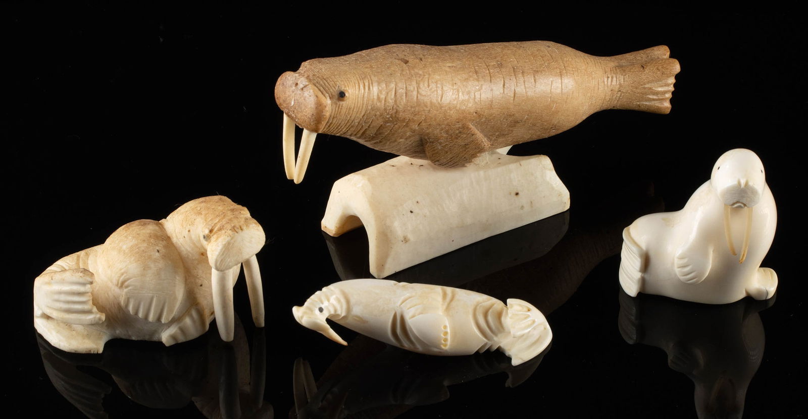 4 Inuit Ivory & Bone Walrus Figurine Carvings: **Originally Listed At $350** Native American / First Nations, Northwestern United States or Canada, Inuit culture, ca. mid to late 20th century CE. A collection of 4 carved walrus figurines made from