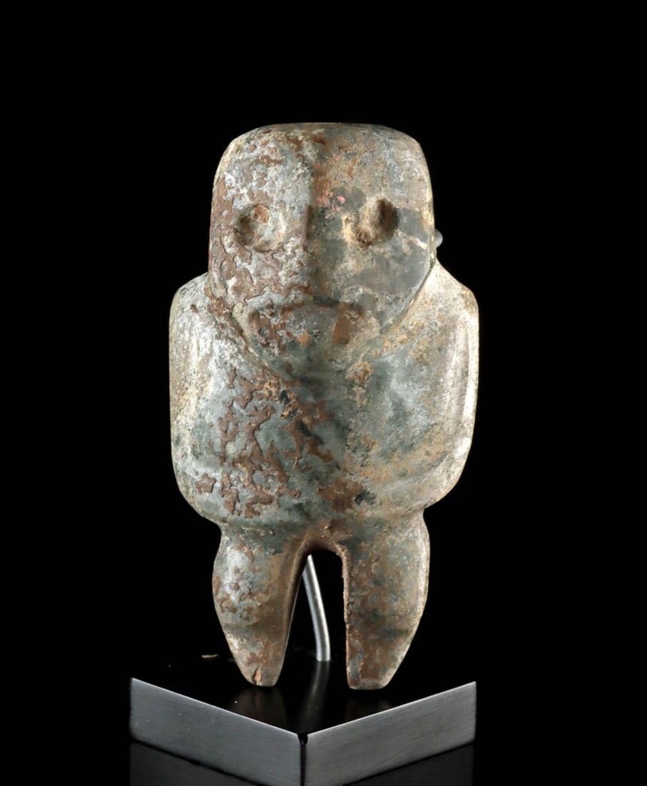 Miniature Mezcala Greenstone Axe God Figure: Pre-Columbian, Southern Mexico, Guerrero region, Mezcala culture, ca. 1st to 8th century CE. A hand-carved greenstone figure of abstract anthropomorphic form, commonly known as an "axe god." This term
