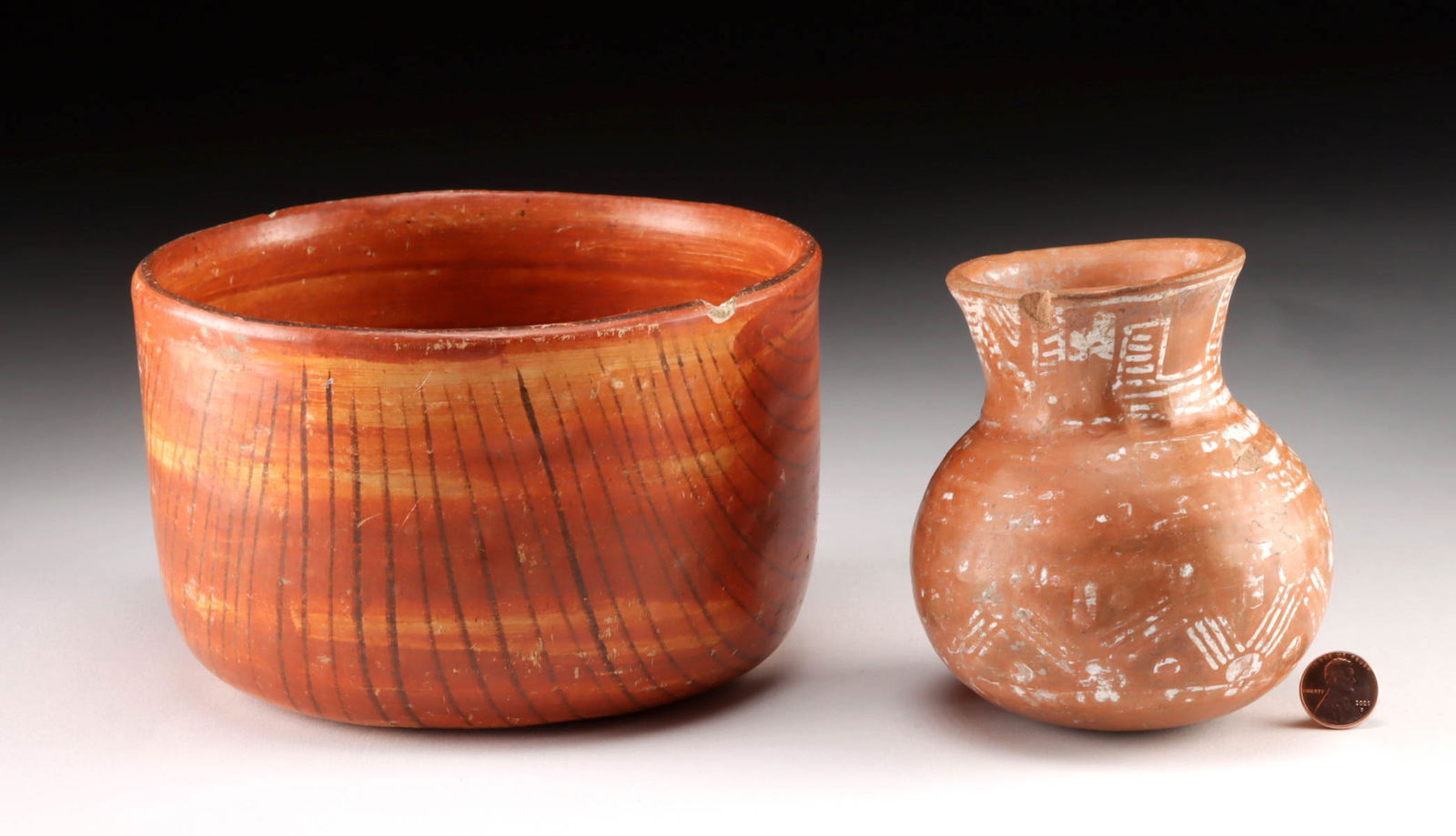 Nayarit Redware Pottery Vessels, Bowl & Jar: Pre-Columbian, West Mexico, Nayarit, ca. 300 BCE to 300 CE. A set of 2 hand-built and stone-burnished pottery vessels, each exhibiting their own hue of red-orange on their respective surfaces. The sph