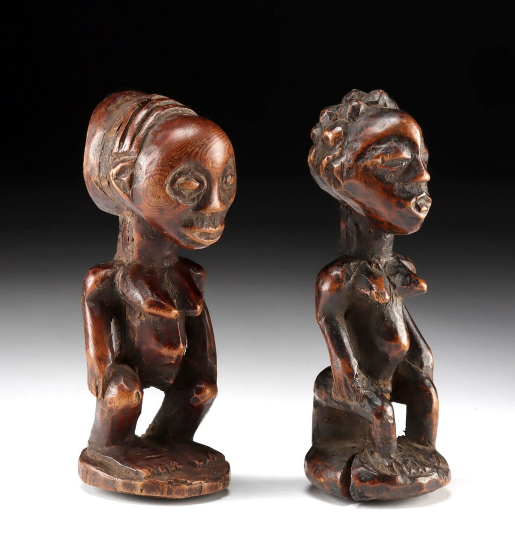 African Kuba / Luba Wood Shrine Figures Female Ancestors (4.75"H): Central Africa, Democratic Republic of the Congo, Kuba / Luba cultures, ca. 19th to early 20th century CE. A finely hand-carved pair of wooden female figures, each depicted nude in a squatting or seat