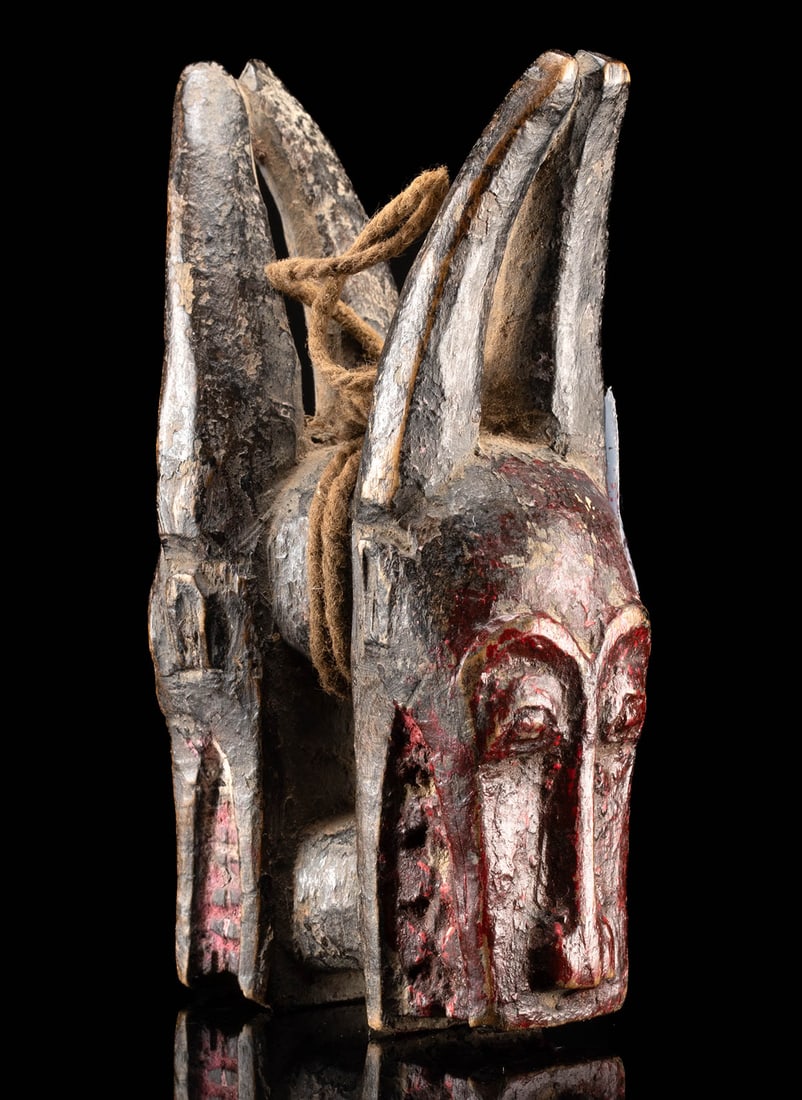Miniature Baule Bo Nun Amuin Maskette w/ Snout and Horns: West Africa, Ivory Coast (Cote d'Ivoire), Baule (Baoule) peoples, ca. late 19th to early 20th century CE. A double-sided wooden Bo Nun Amuin maskette, featuring prominent horns at the top and an anthr