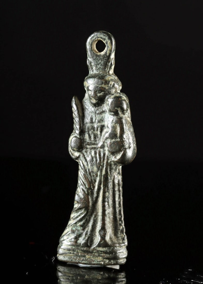 14th C. Spanish Pilgrimage Amulet – St. Anthony with Christ Child: Western Europe, Spain, probably Santiago de compostelo, ca. 14th to 16th century CE. Rare, early and fine bronze amulet of Saint Anthony. Cast in low relief, St. Anthony holds the baby Jesus in his le