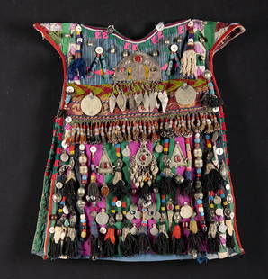 Turkmen Child's Cotton Tunic w/ Brass & Glass Ornaments: Central Asia, Turkmenistan / Afghanistan, Turkmen (Turkoman) culture, ca. mid to late 20th century CE. A child's tunic made from cotton panels patched together with extensive beadwork and brass orname
