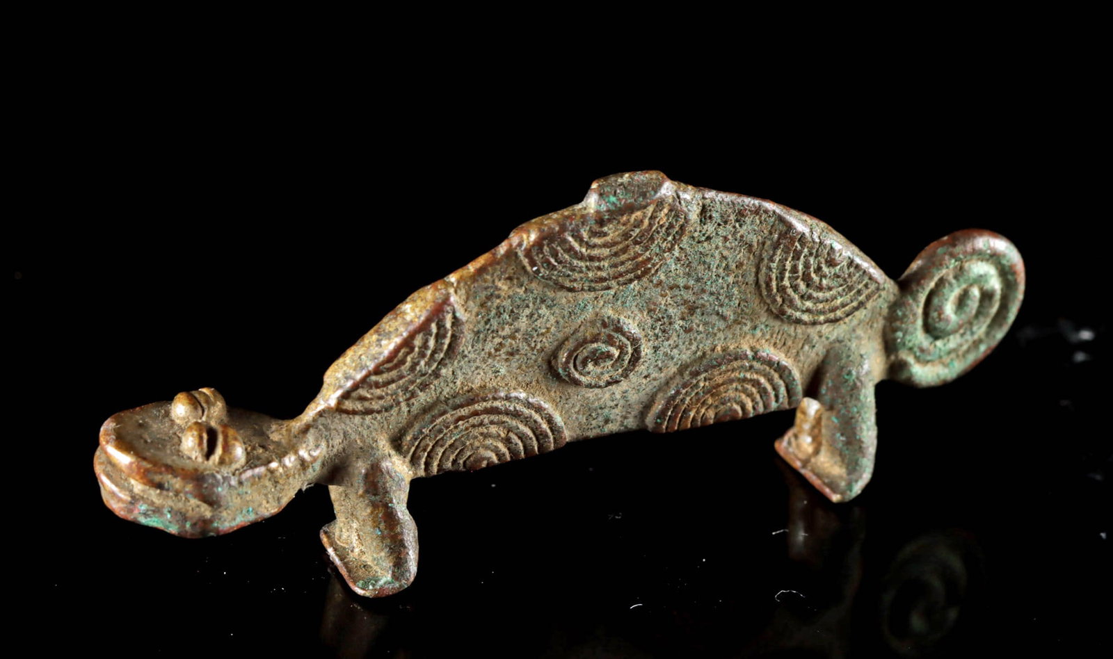 Asante / Ashanti Brass Gold Weight Chameleon Form (2.25"): West Africa, Ghana, Asante / Ashanti (Akan) culture, ca. 19th to early 20th century CE. A finely cast brass gold weight in the form of a chameleon, featuring a flattened, arched back, a curled tail, a