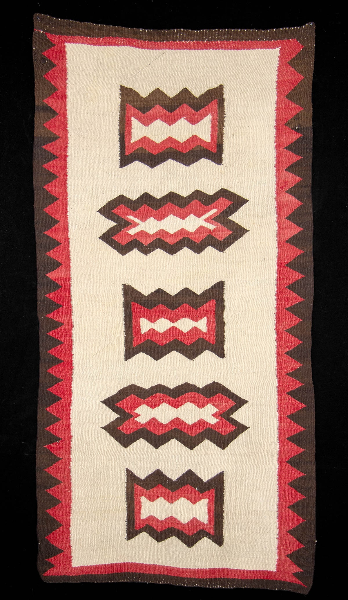 1920s Navajo Woven Ganado-Style Wool Rug / Blanket: Native American, Southwestern United States, Navajo (Dine), ca. 1920s to 1930s CE. A large handwoven wool Ganado-style runner, featuring a supple weave and geometric motifs in red, brown, and white. I