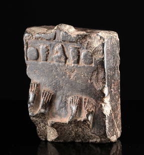 Egyptian Hematite Offering Relief Vessels & Worshippers: Ancient Egypt, Middle Kingdom to Late Dynastic Period, 12th to 31st Dynasty, ca. 1991 to 332 BCE. A large fragmentary hematite stone plinth featuring the remains of two sets of feet, representing two