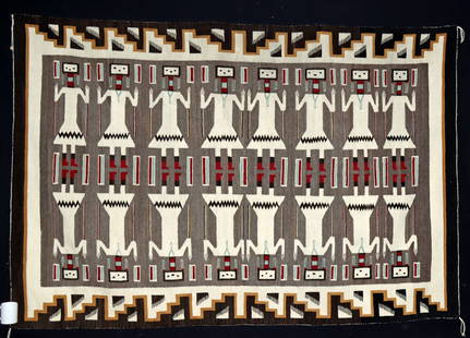 Huge & Superb Navajo Wool Blanket w/ Yei Figures: Native American, Southwestern United States, Navajo (Dine), ca. late 20th century CE. An expansive handwoven wool rug featuring Yei figures - sacred deities in Navajo culture - arranged in two rows, s