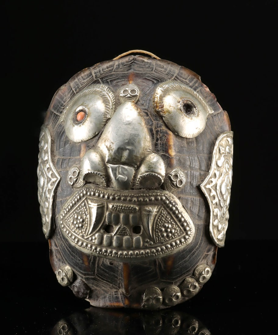 Early Tibetan Turtle Shell Kapala, Wrathful Deity Mask: Central Asia, Tibet, ca. late 19th to early 20th century CE. A smallish Kapala, a ritual cup carved from shell or using human skull caps. In this case the shell of a turtle was used as the cup, with a