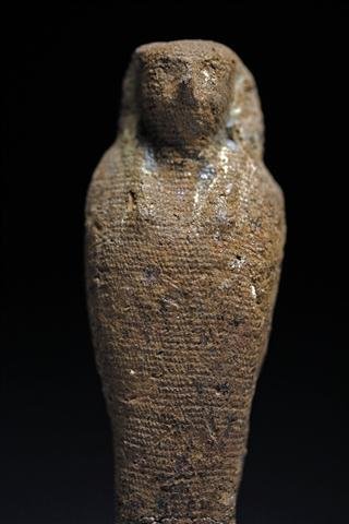 An Egyptian Pseudo-Mummified Horus Figure: From ancient Egypt, 3rd Intermediate - Late Period, ca. 1075 - 343 BC. A linen and resin mummiform figure of Horus to resemble a shabti, complete with tripartite headdress. Attached to wood base. 4"H 