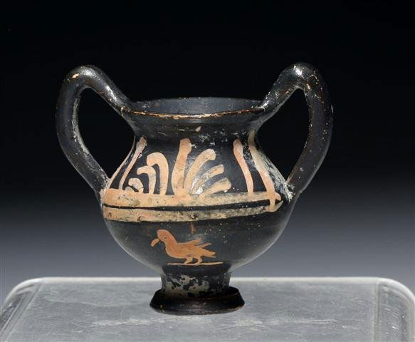 A Greek Xenon Minature Krater with Swan: Greece, Magna Graecia, Ca. 350 BCE. Small twin-handled krater with fan motif, swan painted on underbelly of front. 2-1/4”H. Provenance: Ex-Glenn Woods Collection, Dallas, TX Authenticity Guaranteed