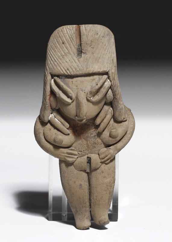 A Pre-Columbian Chupicuaro Pottery Flat: West Mexico, Guanajuato Valley, Ca. 300 to 100 BCE. Pottery flat figurine of indeterminate sex, hands to chest, wearing headband over parted hairdo, stone necklace around her neck. 3-7/8"H Provenance: