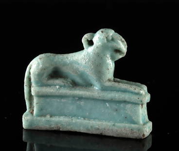 Egyptian Late Dynastic Faience Hieracosphinx Amulet: Egypt, Late Dynastic Period, 26th Dynasty, ca. 664 to 525 BCE. A lovely and quite rare faience amulet in the form of a falcon or hawk headed sphinx, also known as a hieracosphinx, recumbent atop an el