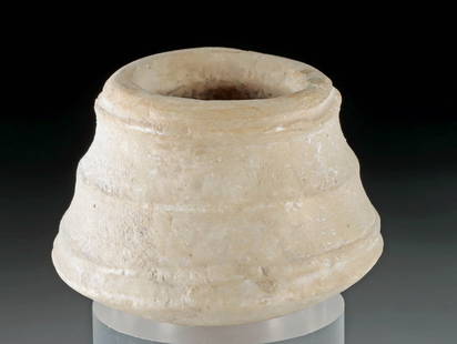 Near Eastern / Egyptian Alabaster Jar, Carinated Base: Near East / Egypt, Late Bronze Age to Iron Age, ca. 3000 to 300 BCE. An alabaster jar with an interesting carinated base and ridged exterior. The symmetrical shape was likely crafted using a bow drill