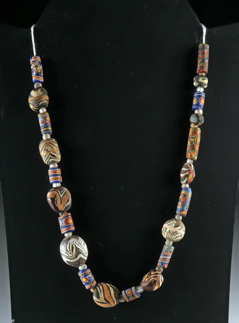 Ancient Roman Millefiori & Marvered Glass Beads: Near East / Eastern Mediterranean, Roman, Imperial Period, ca. 100 to 400 CE; Phoenicia or Carthage, ca. 400 BCE to 400 CE; Ancient Egypt to Islamic Period, ca. 100 BCE to 600 CE. A strand of 42 ancie