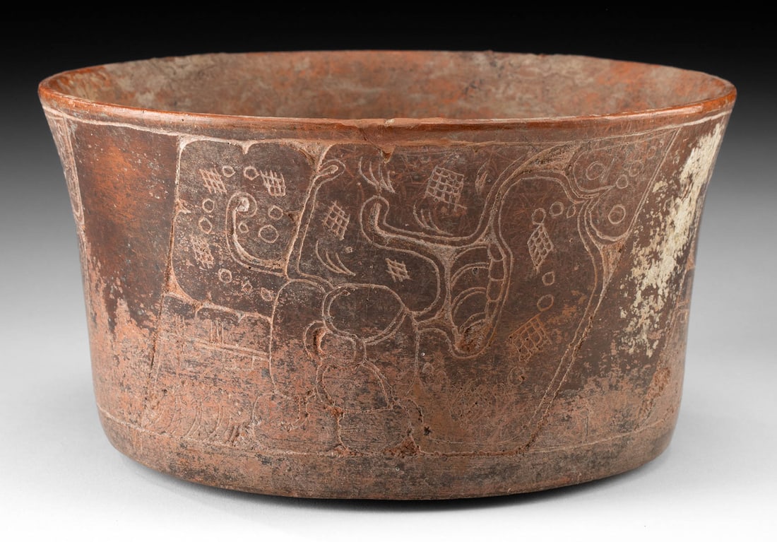 Maya Classic Redware Bowl - Serpent & Glyph Decoration: Pre-Columbian, Mesoamerica, Maya Civilization, Classic Period, ca. 250 to 900 CE. A captivating example of Classic Period Maya ceramic artistry, this redware pottery bowl features a slightly concave b
