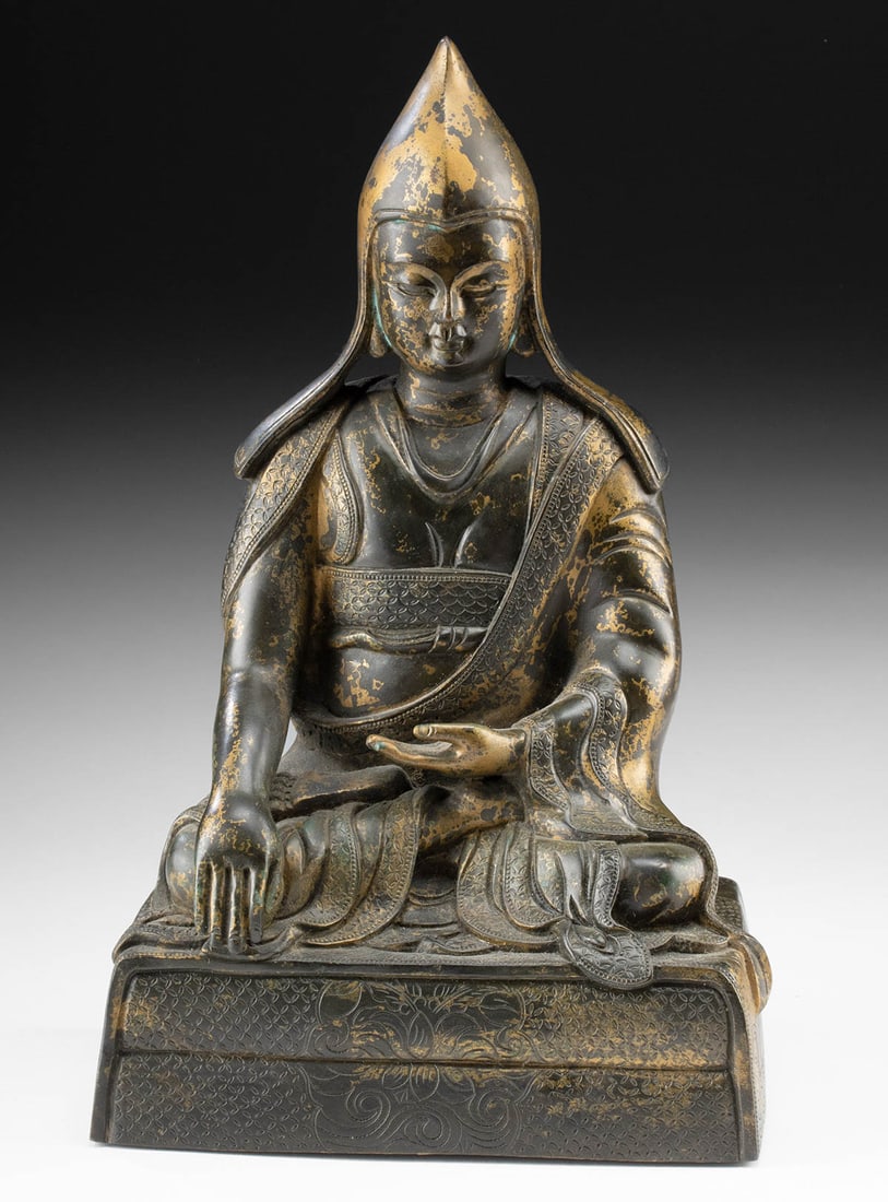 Tibetan Bronze Gelugpa Lama in Meditation: East Asia, Tibet, ca. 19th to early 20th century CE. A cast bronze sculpture of a seated lama or high-ranking monk, likely a Gelugpa teacher within the Tibetan Buddhist tradition. The figure sits in m