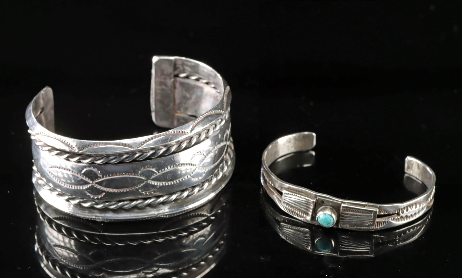 Two Navajo Sterling Silver & Turquoise Cuff Bracelets: **Originally Listed At $300** Native American, Southwestern United States, Navajo (Dine), ca. mid to late 20th century CE. A pair of sterling silver cuff bracelets, each featuring distinctive stamped