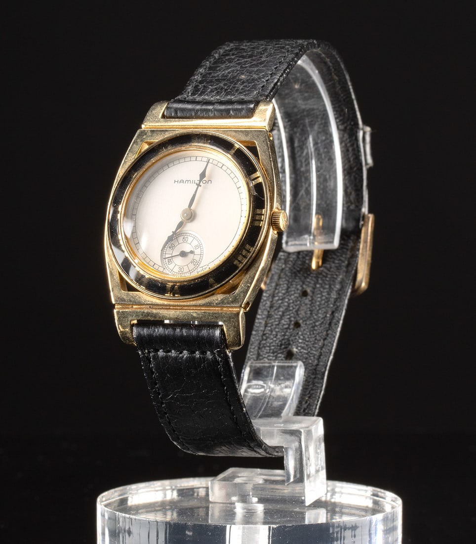 1990s Hamilton Piping Rock 17K Gold Plated Watch: **Originally Listed At $300** United States, ca. 1990s CE. A Hamilton Piping Rock wristwatch with quartz movement, featuring a black enamel bezel and a stainless steel case plated with 16 to 17K gold.