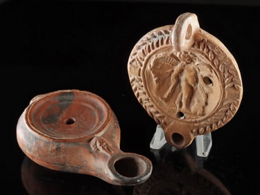 Two Roman Pottery Oil Lamps w/ Long Spout & Cupid