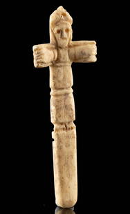 9th C. Byzantine Bone Reliquary Crucifix Pendant: Ancient Near East, Byzantine Empire, ca. 9th to 13th century CE. A remarkable crucifix pendant, hand-carved from the bone of an ungulate to feature an abstract figure of Christ, pierced with a suspens