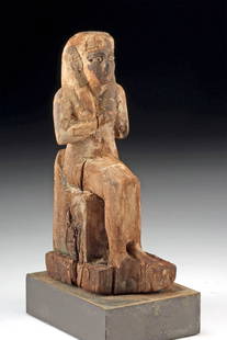 Rare Egyptian Wood Statuette Depicting Isis Lactans: Ancient Egypt, Late Dynastic to Ptolemaic Period, ca. 656 to 30 BCE. This finely carved wooden statuette represents Isis Lactans, the goddess Isis in her maternal aspect, shown seated on a throne