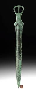 Rare Egyptian Bronze Short Sword Openwork Pommel: Ancient Egypt, Middle Kingdom, dynasties 11 through 13, ca. 2030 to 1650 BCE. Rare and highly desirable short sword made of solid bronze. Straight double edged blade with narrow flat central ridge.