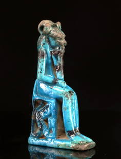 Egyptian Brilliant Blue Faience Amulet Goddess Sekhmet: Egypt, Late Period, 26th to 30th dynasties, ca. 664 to 332 BCE. A vivid blue faience amulet depicting the lion-headed goddess Sekhmet, seated on a throne in traditional divine posture. The goddess is