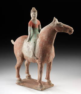 Chinese Tang Dynasty Pottery Horse & Rider: East Asia, China, Tang Dynasty, ca. 618 to 906 CE. A painted terracotta horse and rider, the equestrian figure a female dressed in an elegant headdress and clothing and holding her arms up as if pulli