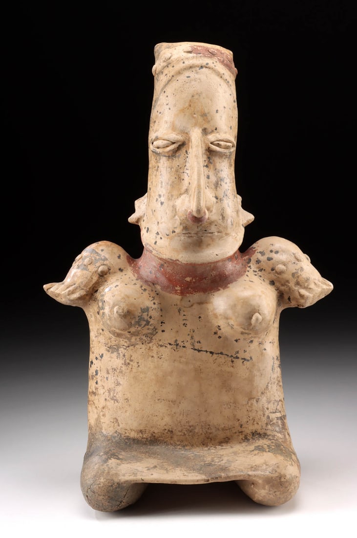 Semi-Nude Jalisco Female - Scarified & Seated: Pre-Columbian, West Mexico, Jalisco, ca. 300 BCE to 300 CE. A bold and sensuous seated female figure, modeled in buff clay and embellished with black and red slip, her form imbued with volume and ritu