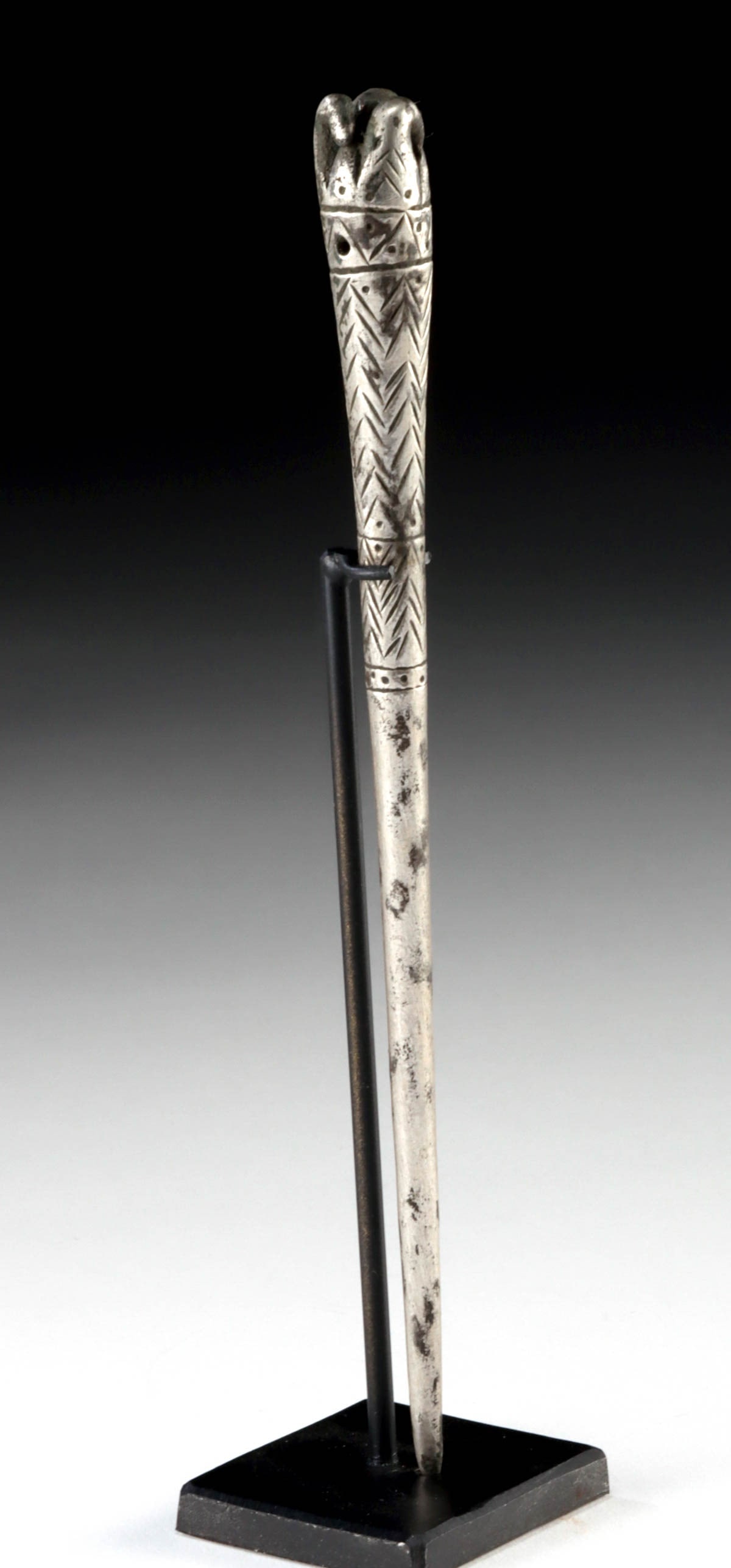 Rare Luristan Silver Cloak / Hair Pin, ex-Piscopo: Central Asia, northwest Iran, ca. 1200 to 800 BCE. This is one of those finds that makes a dealer smile. Found in a collection of miscellaneous items purchased from the widow of bronze weapons collect