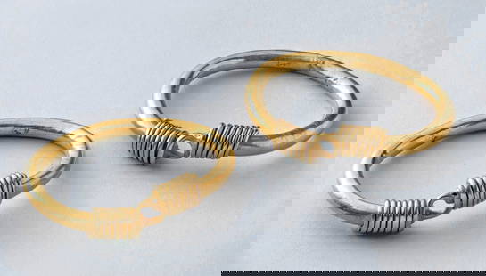 Ptolemaic Gold Bracelets Coiled Wire Clasps (pr): Egypt, Ptolemaic Period, ca. 3rd to 1st century BCE. A superb matched pair of ancient gold bracelets from Ptolemaic Egypt, each composed of a rounded tubular band of high-karat gold and secured by