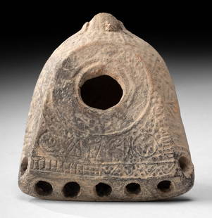 Byzantine Holyland Pottery Oil Lamp - 7 Wick Holes: Near East, late Roman to early Byzantine, Holyland, ca. 3rd to 5th century CE. A finely modeled pottery oil lamp of flattened shovel form, designed with a broad, level upper surface and beveled sides.