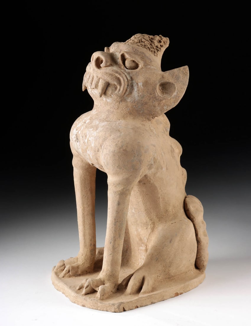 Large Chinese Tang Dynasty Pottery Guardian Spirit: East Asia, China, Tang Dynasty, ca. 618 to 907 CE. A fierce sentinel frozen in terracotta, this spirit guardian or zhenmushou was sculpted to guard the tomb and soul of the deceased. Fashioned in a se