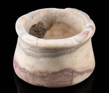 Near East or Egypt Ancient Alabaster Jar w/ Pink Veins: Near East / Egypt, Late Bronze Age to Iron age, ca. 3000 to 300 BCE. An alabaster jar with lovely pink veining throughout. The vessel rests on a thick, flat base and features a cylindrical receptacle