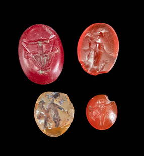Roman Incised Carnelian / Glass Intaglios (4): **Originally Listed At $600** Rome, Imperial, ca. 1st to 3rd century CE. A wonderful gathering of 4 incised intaglios, 1 of glass and 3 of carnelian, all of ovoid form and boasting hues of coral, scar