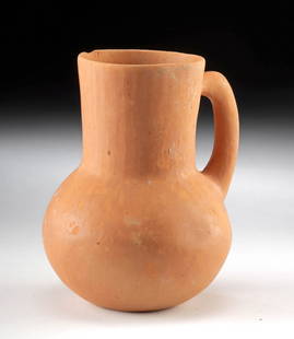 Ancient Amlash Redware Pottery Pitcher: Ancient Central Asia, southern Azerbaijan and northern Iran, Ardabil region, Amlash, ca. 1200 to 800 BCE. A petite pottery redware pitcher with a globular body and handle. Although close to major Meso